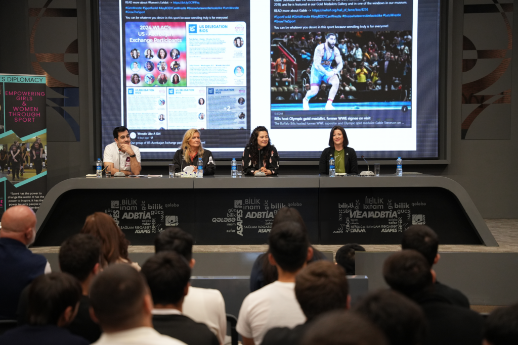 A three person panel discussion with one interpreter on the women's wrestling movement in the U.S. at a school in Azerbaijan. 