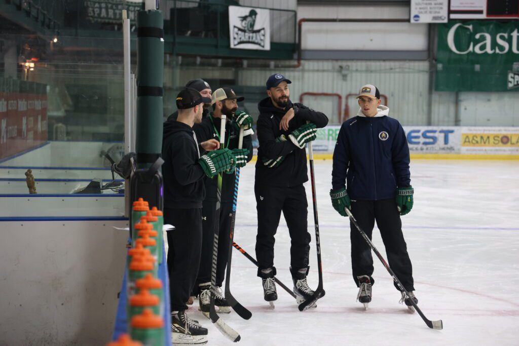 Latvian coaches with Castleton's Women's Ice Hockey Coach