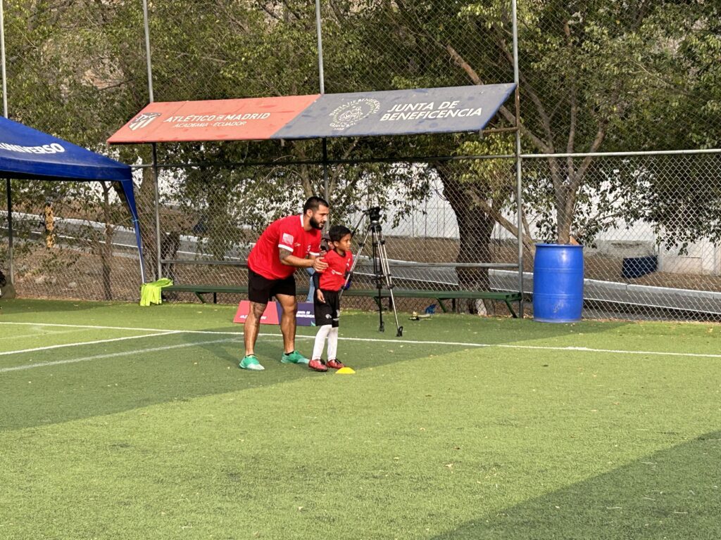 Coach Danny working with a young athlete